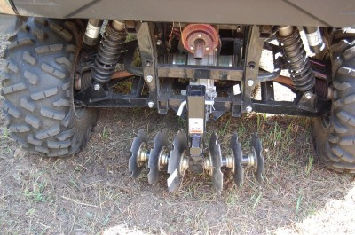 The GroundHog MAX disc/plow, mounted here on the back of a Kawasaki Teryx, is an inexpensive and easily portable way to work up ground for food plots, gardens, and more.