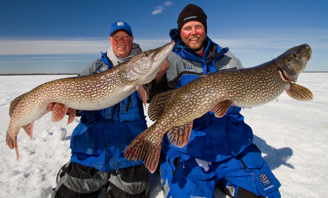 Tip-up with flag while ice fishing for Northern Pike on a lake in