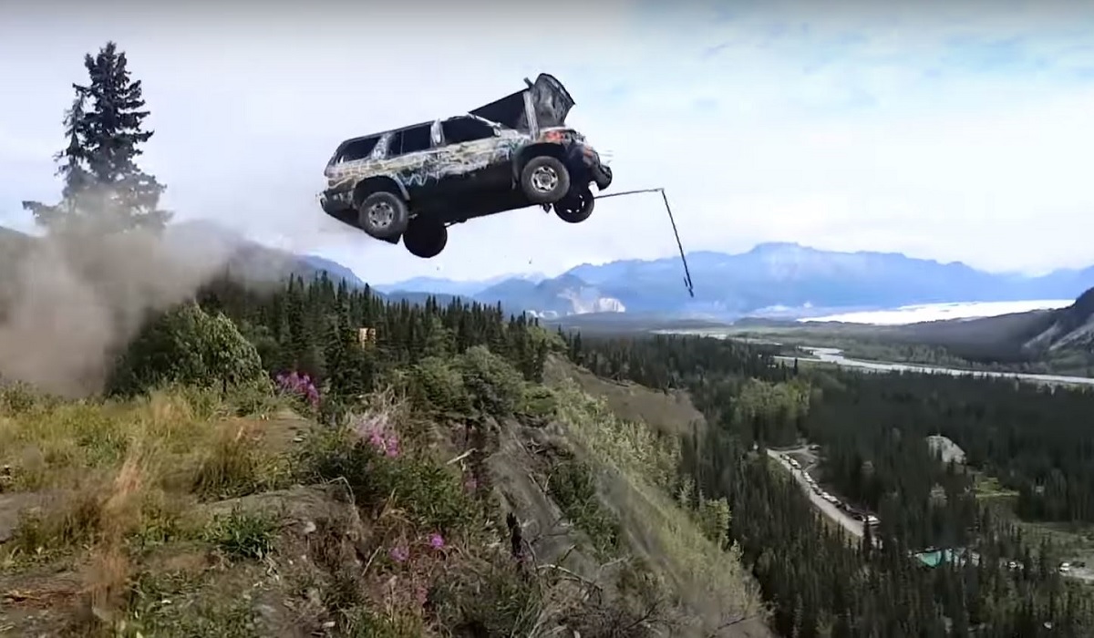 Video This is How Alaskans Have Fun; By Launching Cars Off a 300Foot
