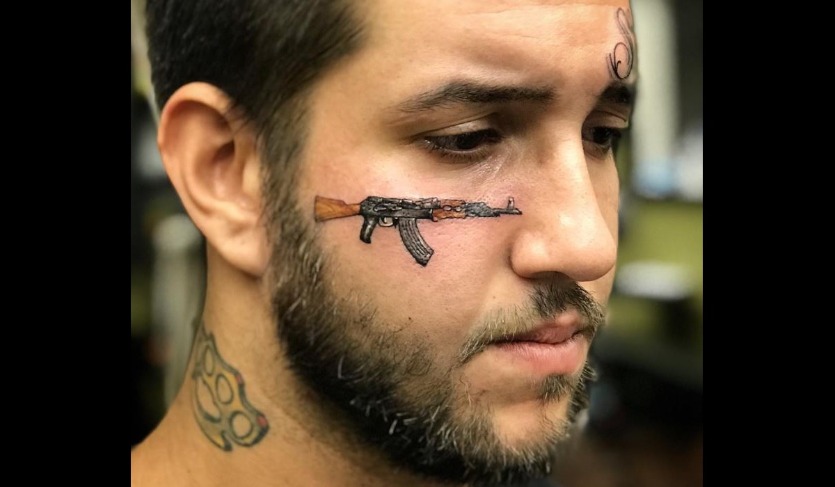 Think This Guy Will 'Ragret' Getting an AK-47 Face Tattoo?