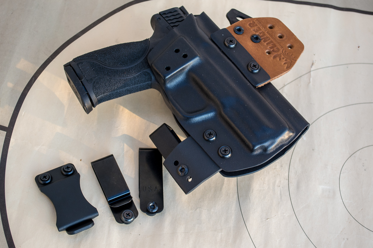 After trying just about everything, I've settled on inside the waistband holsters like this Clinger No Print Wonder and similar models. 