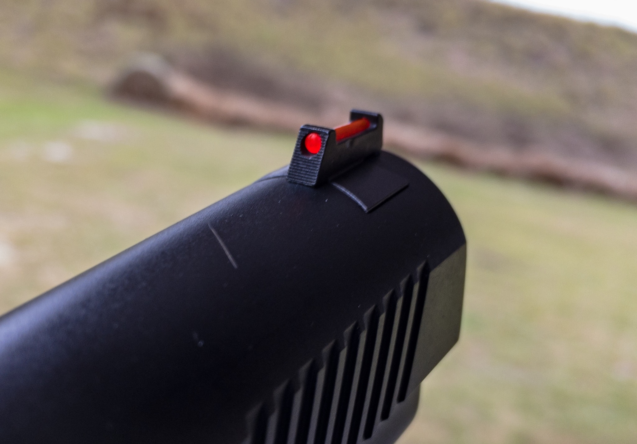 The front sight housing contains a red fiber optic pipe. It's bright and easy to pick up without being distracting.