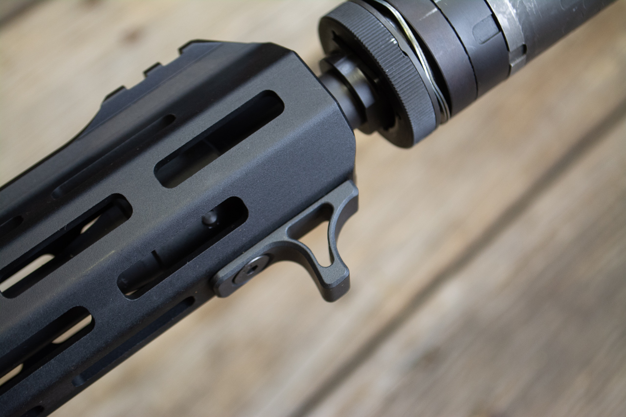 The handguard is surrounded by M-LOK slots. One is used for the hand stop.