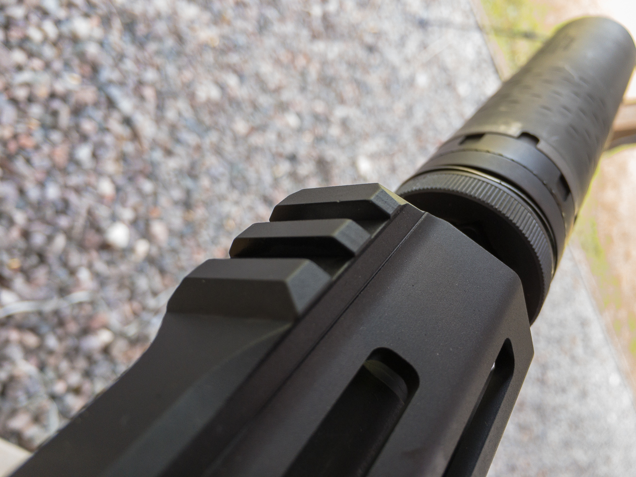 Most of the top handguard surface is smooth. There are short rail segments up front for back up iron sights.
