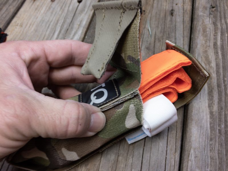 Knowing how to use a tourniquet is the first step. You also need to have it with you. A quick-access pouch like this one from Blue Force Gear helps. 