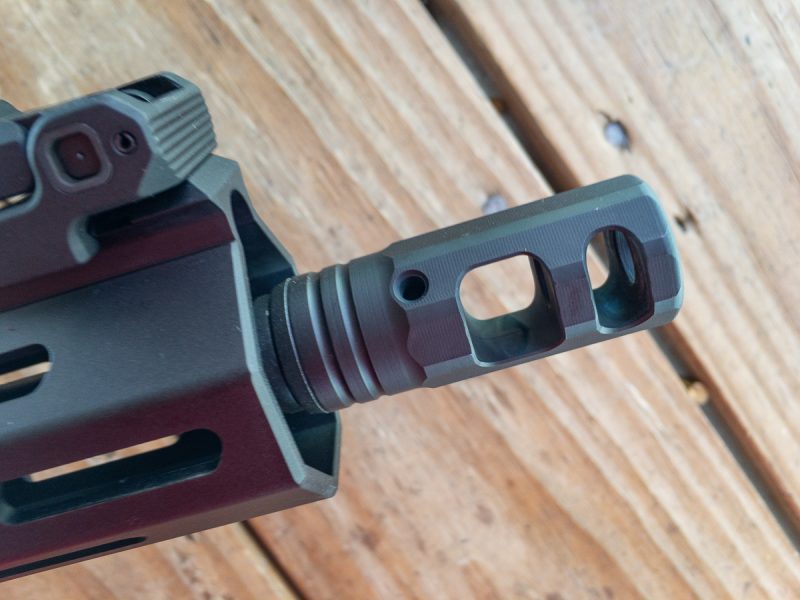 The muzzle brake directs gas outward and upward to reduce felt recoil and minimize muzzle flip.