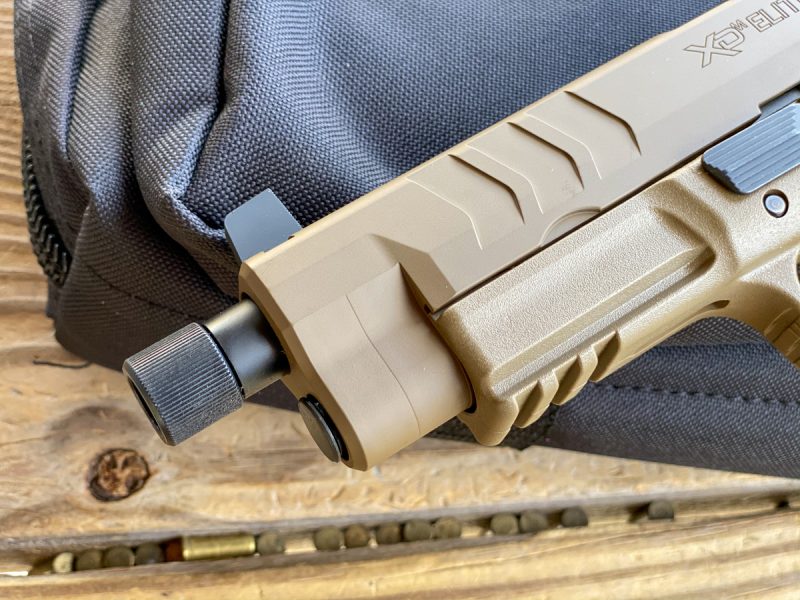 Note the enlarged slide serration pattern. The Tactical OSP model also features a threaded barrel.